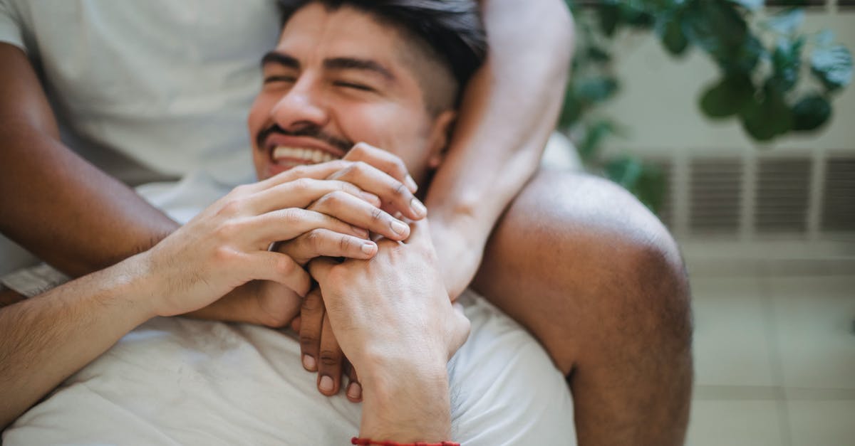 Why would cockroaches and other pests thrive in a hotel? [closed] - Unrecognizable Man Hands Embracing Other Man by Neck