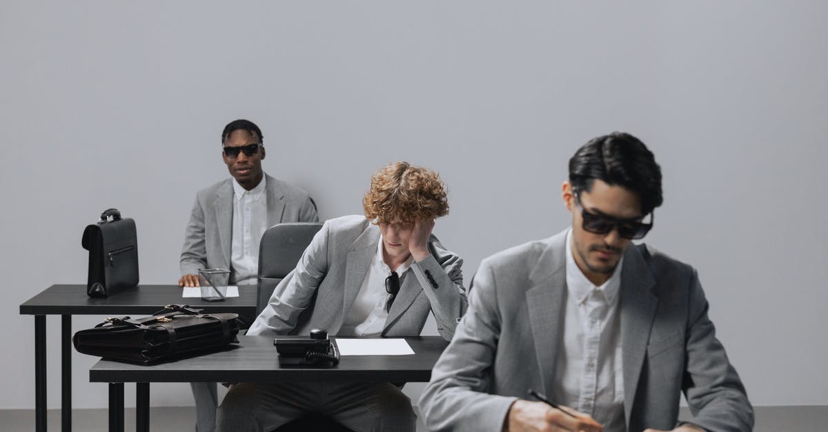 Will a smartcard work alongside a railcard? - Man in Gray Suit Jacket Standing Beside Man in Gray Suit