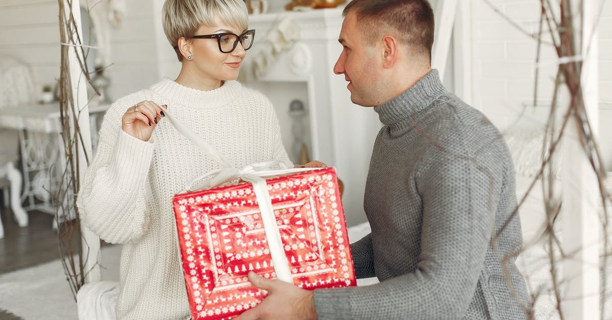 Will businesses be open on Christmas in Mexicali? - Happy Couple Unpacking Present Together