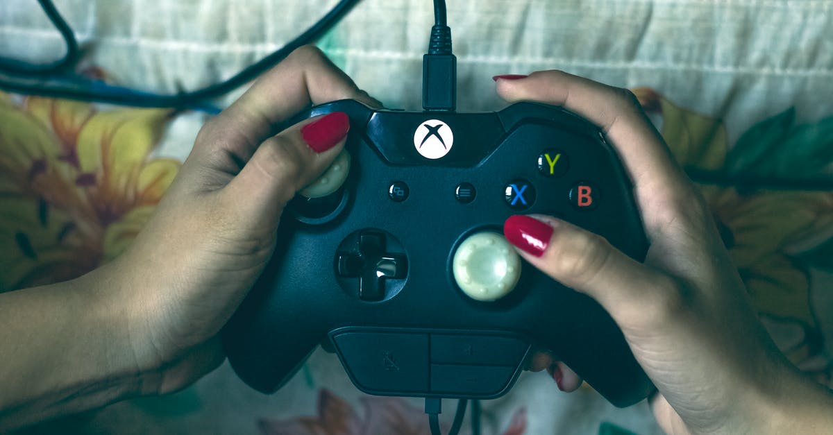 Will I owe customs duty on Xbox One X while going to India? - Person Holding Microsoft Xbox One Controller