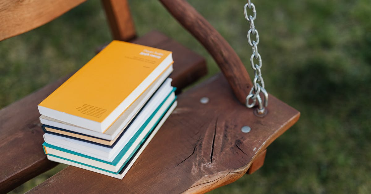 Will knowledge of Yiddish be useful traveling in Israel? - From above of pile of colorful books on wooden bench of garden swing on quiet summer evening