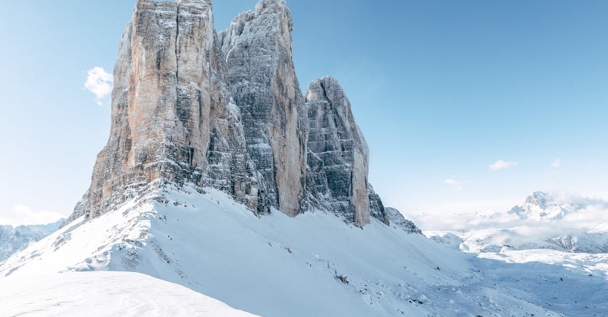 Will May be snowy in the Dolomites? - A Rock Mountain Surrounded By Snow Covered Ground