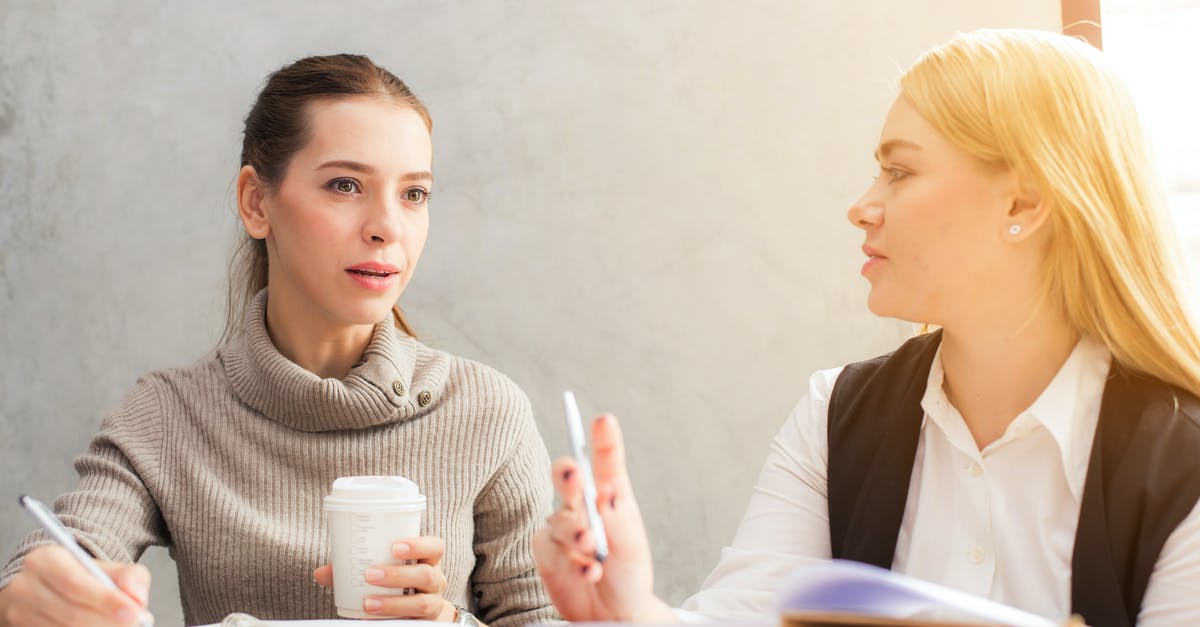 Will my German Aldi Talk work in Austria? - Two Women Holding Pen