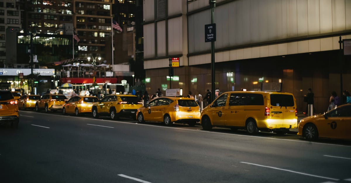 Will renting a car ad hoc in NYC be much more expensive than booking it beforehand? - Contemporary various yellow cabs parked on street at night Will renting a car ad hoc in NYC be much more expensive than booking it beforehand? - Contemporary various yellow cabs parked on street at night