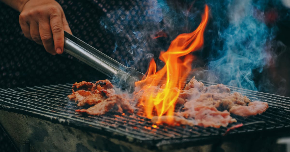 Will the cabin crew heat your own food up? - Close-Up Photo of Man Cooking Meat