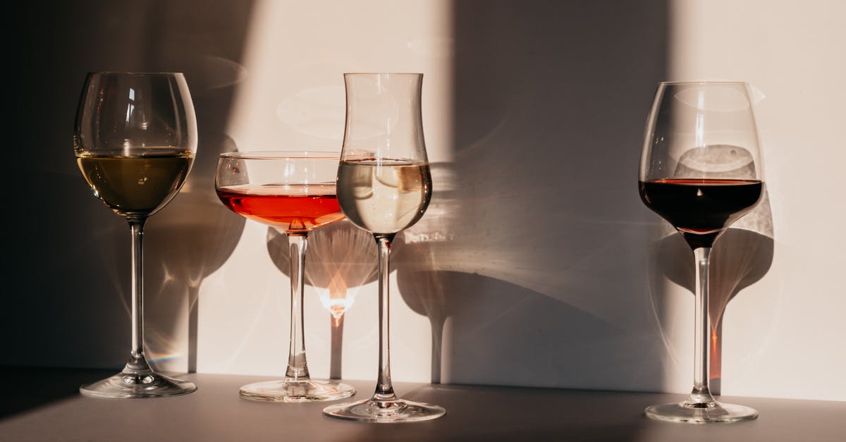 Will they serve alcohol to a Muslim in the Maldives? - Different sorts of wine in various glasses on table in sunlight