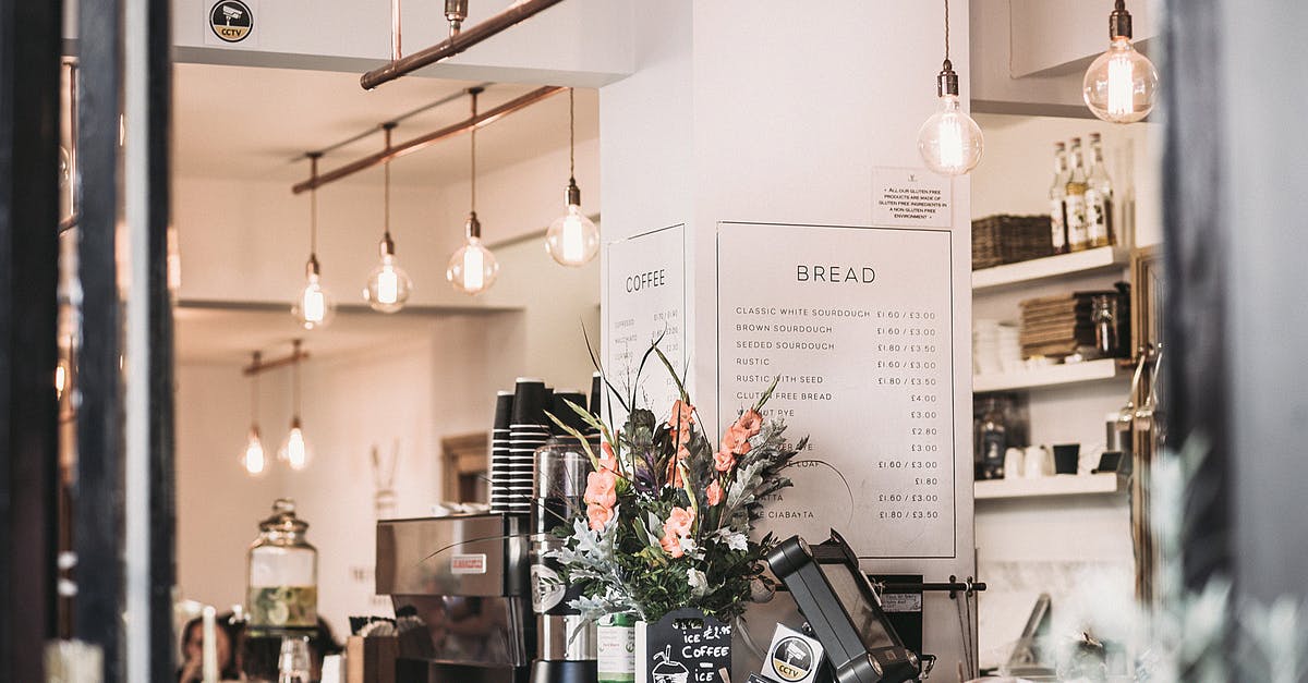 Wine price in a retail shop - Italy [closed] - Inside the Restaurant With Pendant Lamps and Flowers