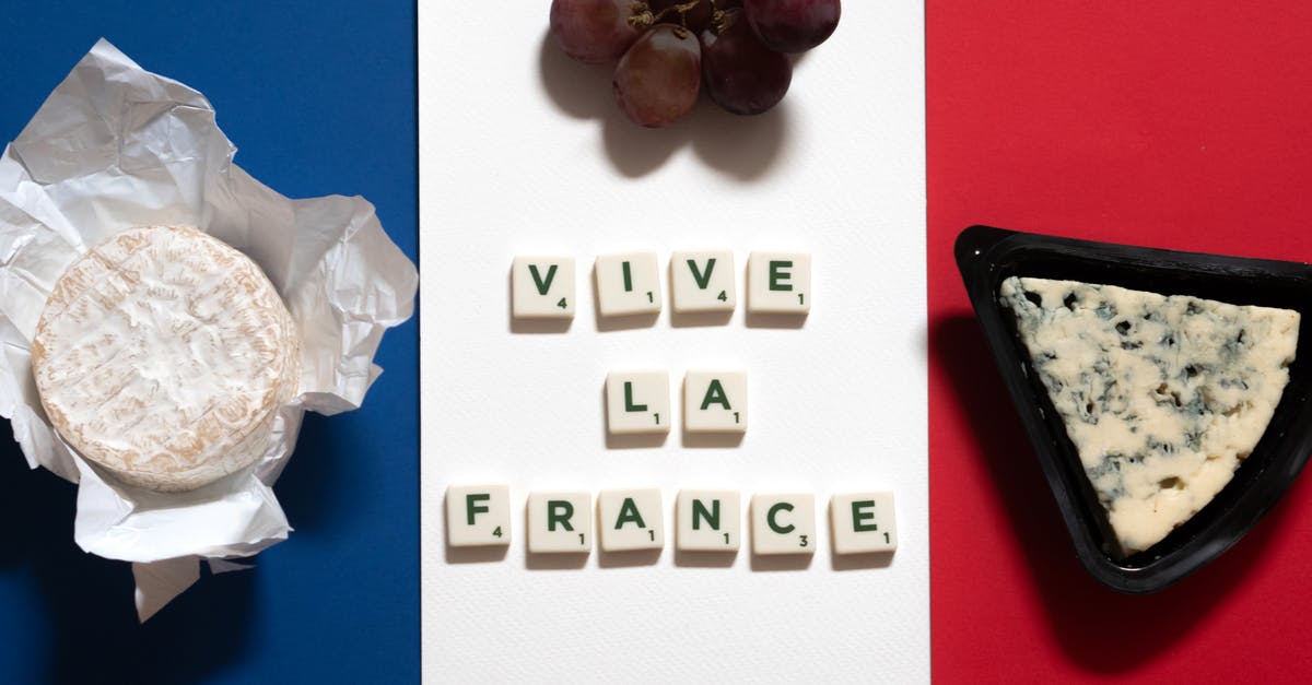 Wording of France 'fully vaccinated' entry requirements - Letter Tiles Beside Food