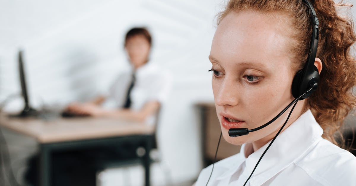 Working and Studying in Russia [closed] - A Woman in White Polo Shirt Wearing a Headset at Work