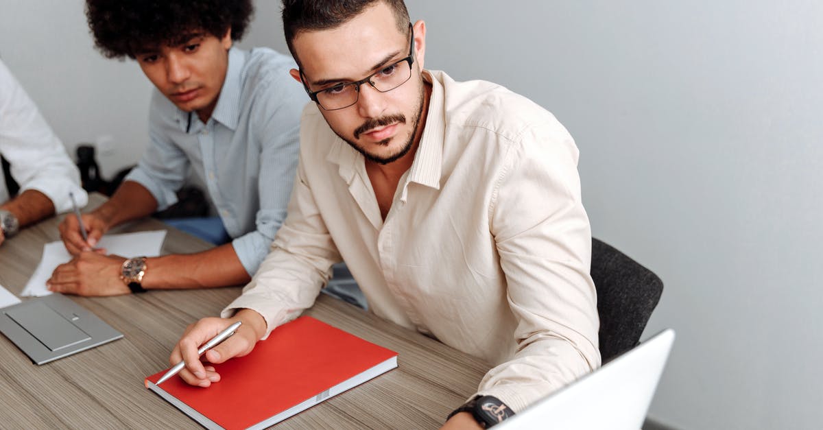 Working on eTA for a non-Canadian company - Man Wearing Beige Dress Shirt Looking at a Laptop