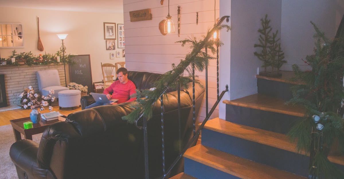 Working remotely on the French work and holiday visa? - Man Using Silver Macbook While Sitting on Black Corner Sofa