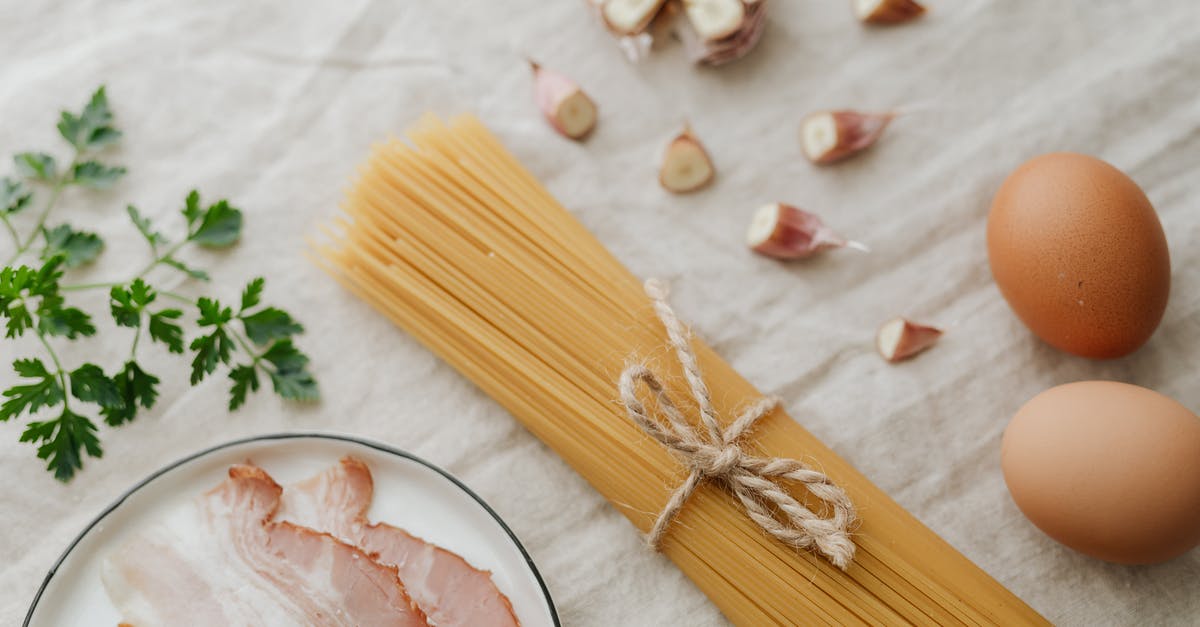 Would uncooked bacon go bad in a transatlantic flight? - Photo Of Sliced Garlic Beside Pasta