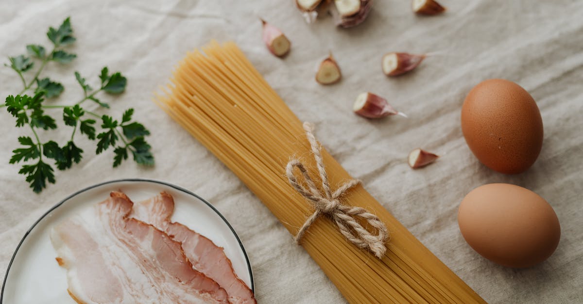 Would uncooked bacon go bad in a transatlantic flight? - Photo Of Egg Beside Pasta