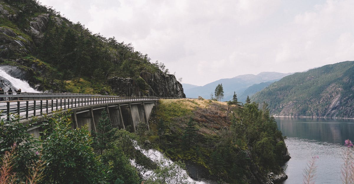 Yosemite and Lake Tahoe Road Trip Assistance [closed] - Picturesque landscape of rough mountain river running through mountainous terrain towards lake under bridge in overcast day